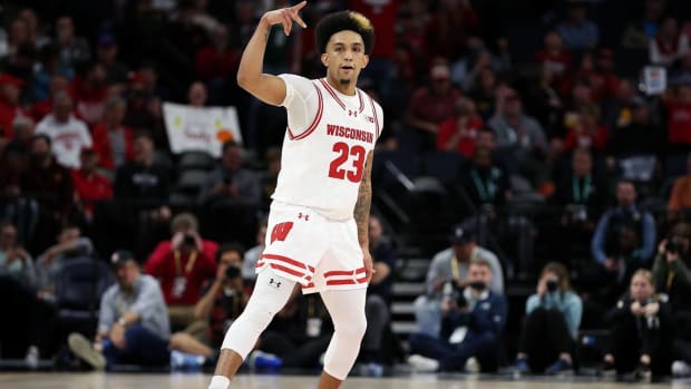 Wisconsin guard Chucky Hepburn celebrates after scoring a basket in a game.